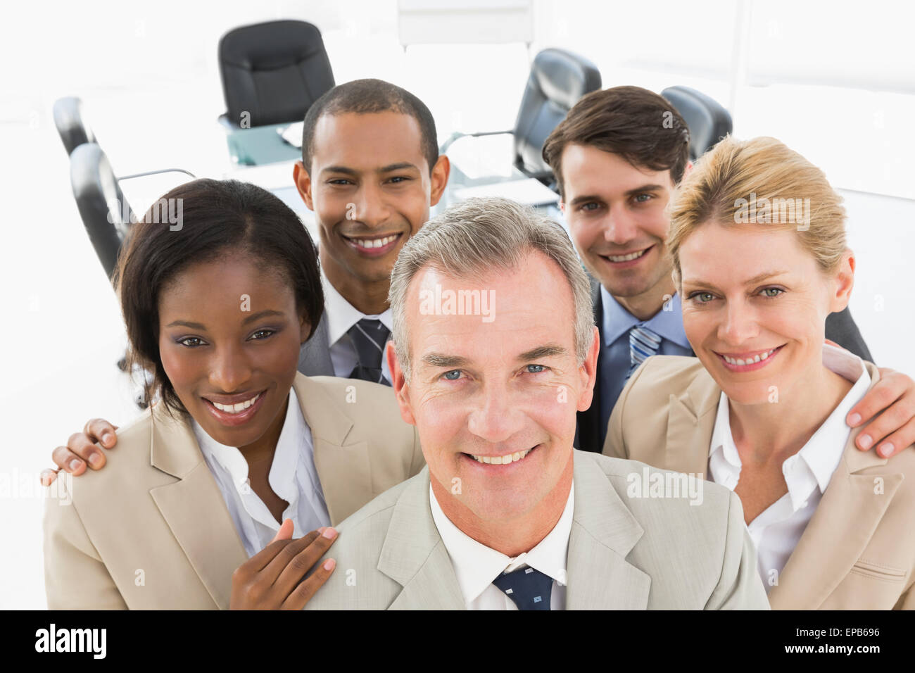 Diverse business team smiling up at camera Stock Photo - Alamy