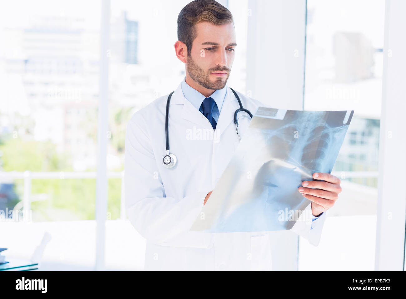 Serious young hispanic male doctor hi-res stock photography and images ...