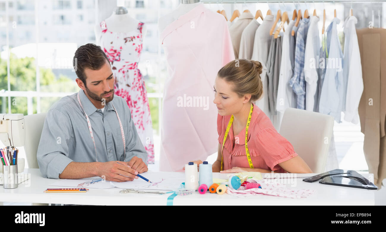 Fashion designers at work in bright studio Stock Photo - Alamy