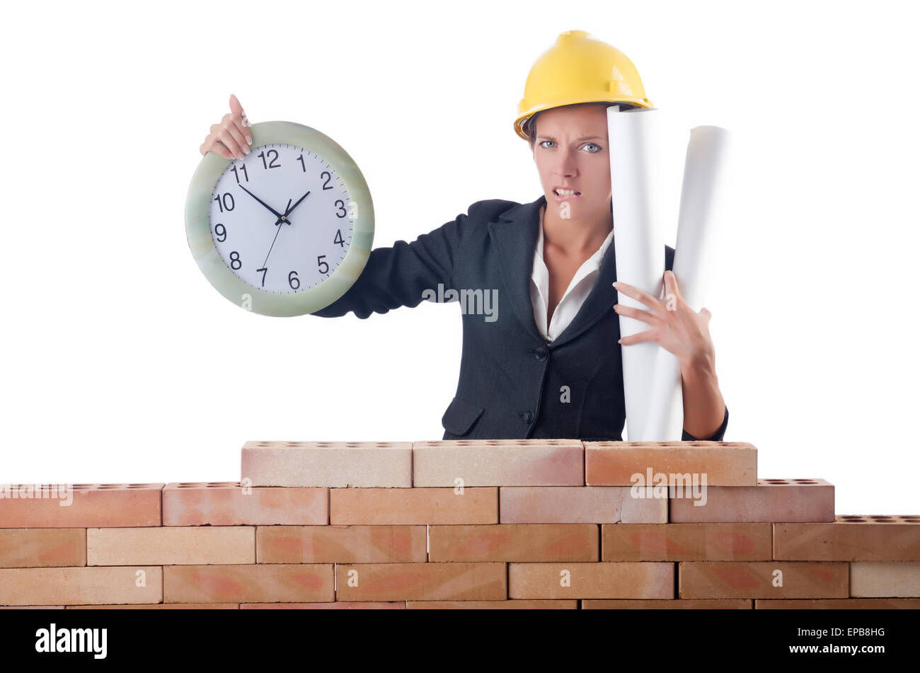 Woman construction worker with clock on white Stock Photo - Alamy