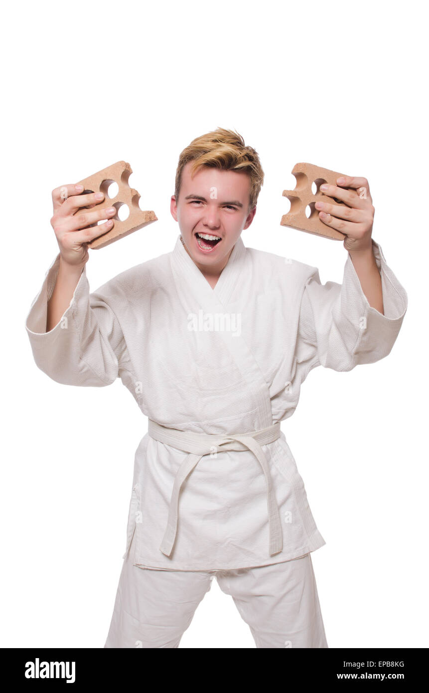 Funny karate man breaking bricks isolated on white Stock Photo