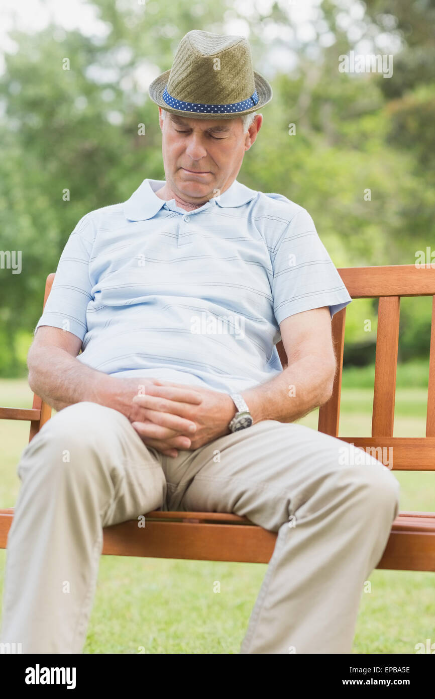 Senior man sleeping on bench at park Stock Photo - Alamy