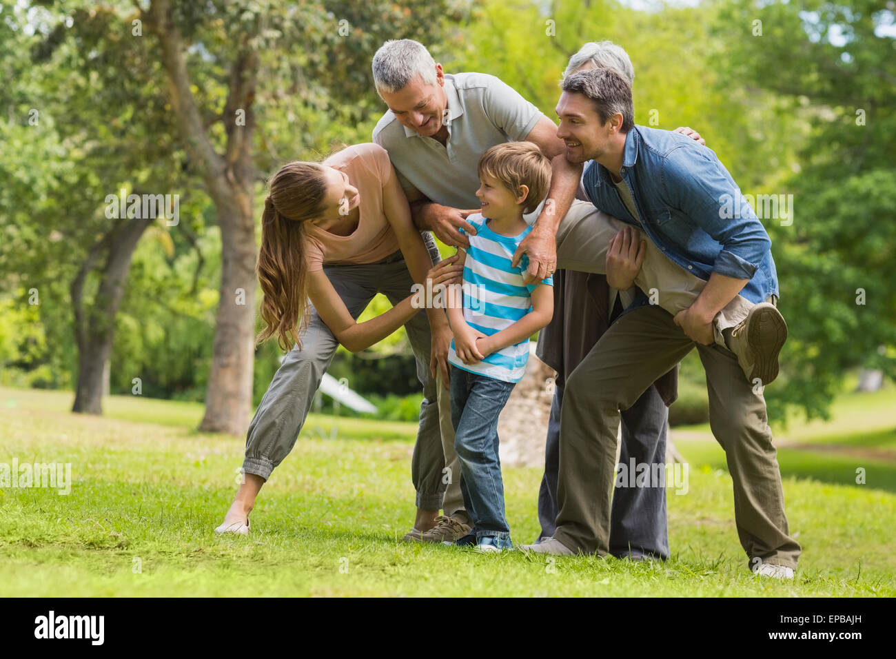 Family playing in park Stock Photo - Alamy