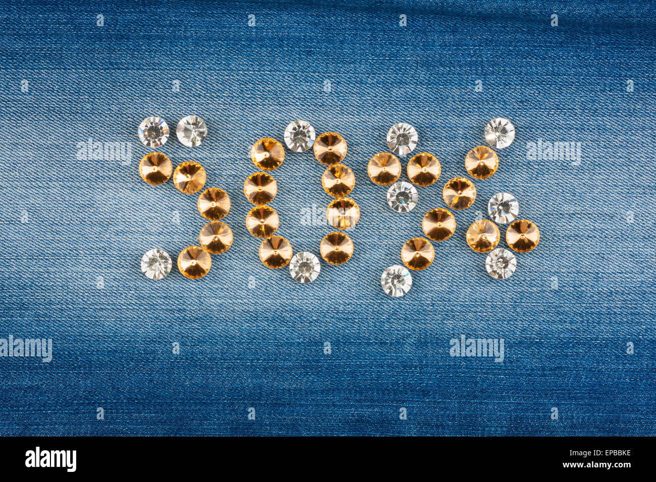 Fifty percent made from crystals on jeans fabric, as background Stock Photo