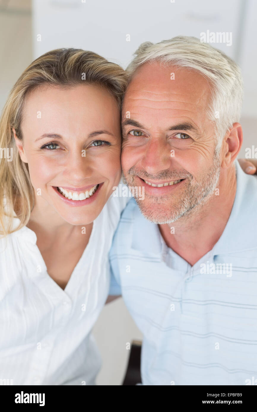 Happy couple smiling up at camera Stock Photo - Alamy