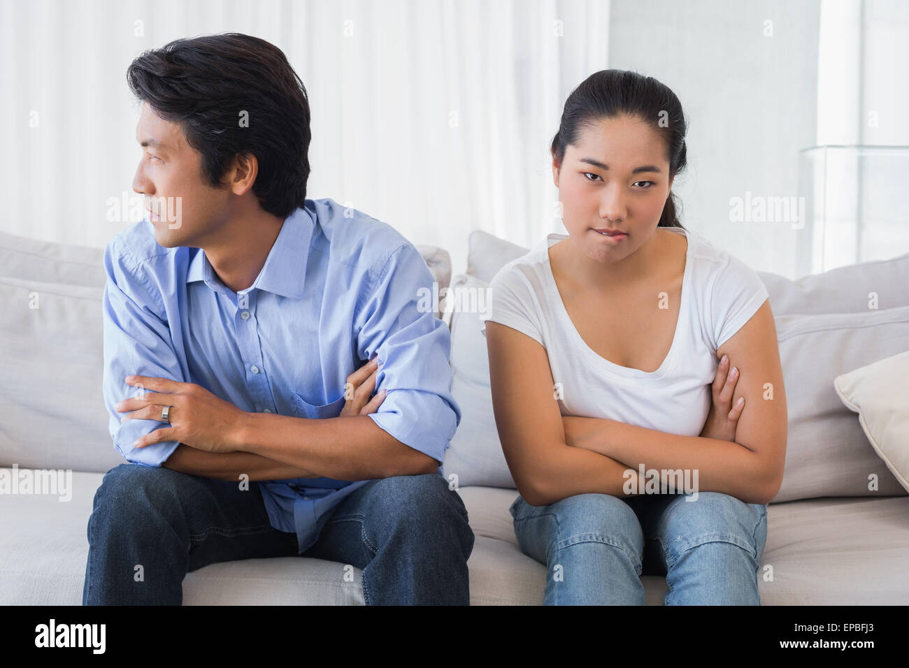 Couple not talking after a dispute on the sofa Stock Photo - Alamy