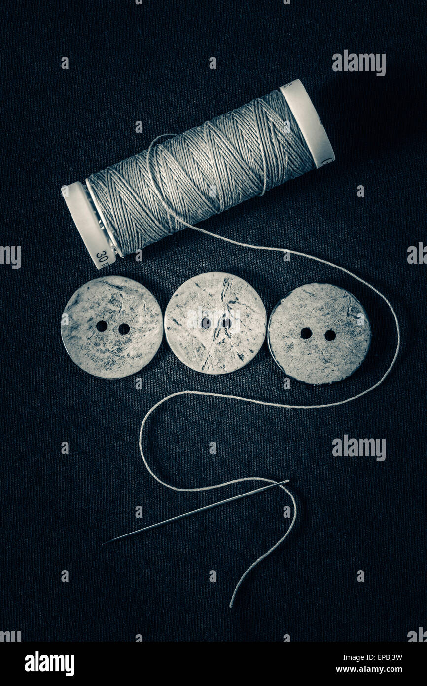 Thread ,buttons and needle monochrome