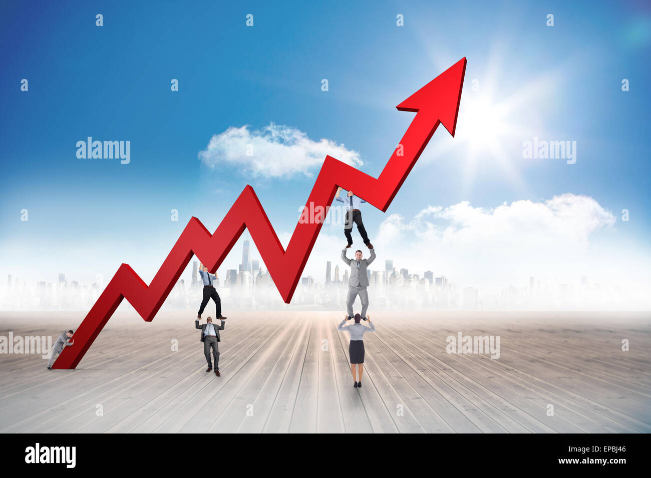 Business team holding up arrow against dark room Stock Photo - Alamy