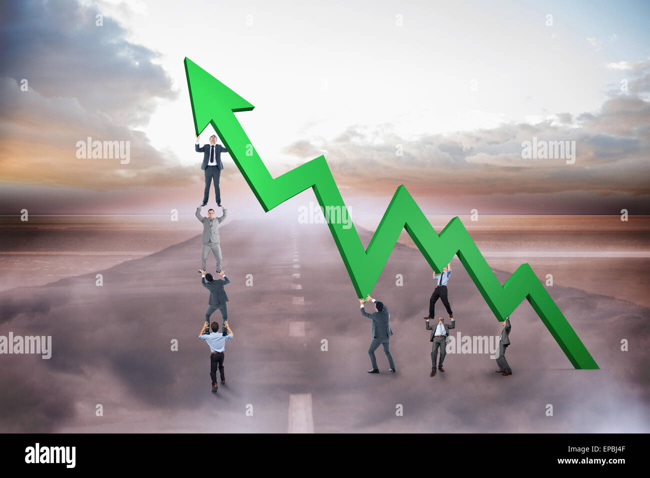 Composite image of business team holding up arrow Stock Photo - Alamy