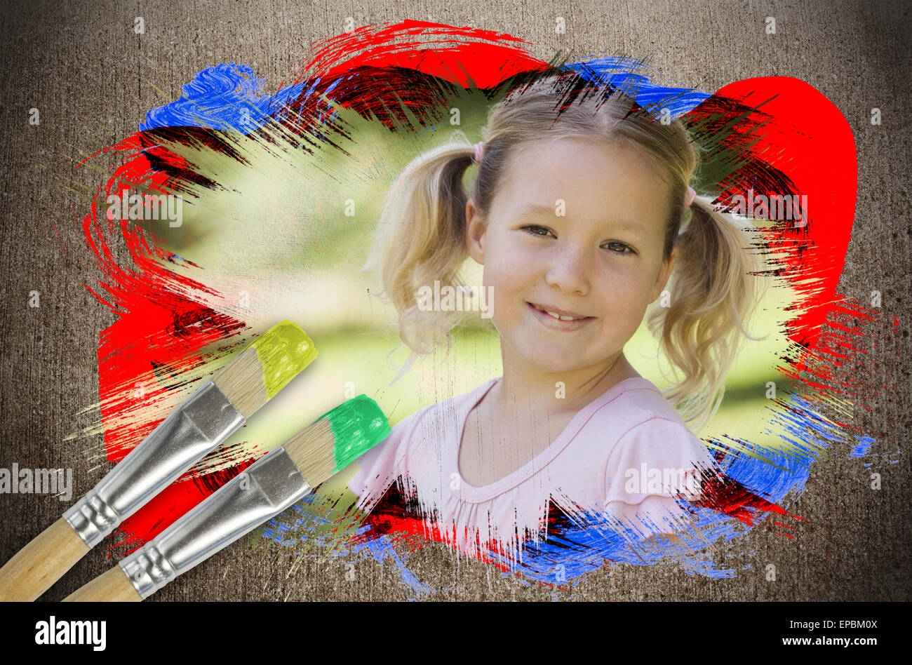 Composite image of little girl smiling in the park Stock Photo - Alamy
