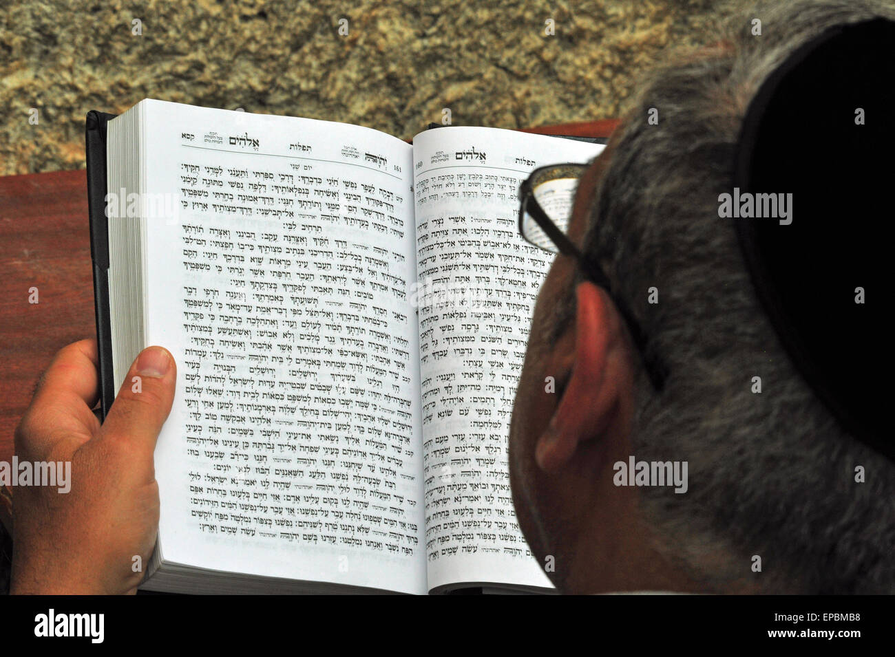 Jewish Pilgrim is reading the Thora at the Wailing Wall, Jerusalem, Israel. Stock Photo