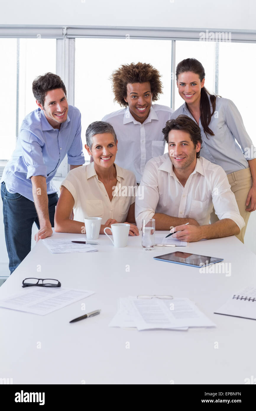 Attractive business people smiling in the workplace Stock Photo - Alamy
