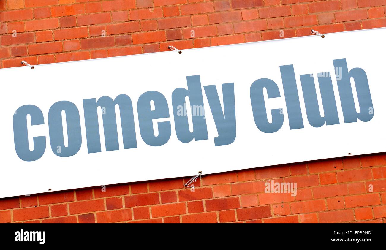 Comedy club sign against red brick wall Stock Photo Alamy