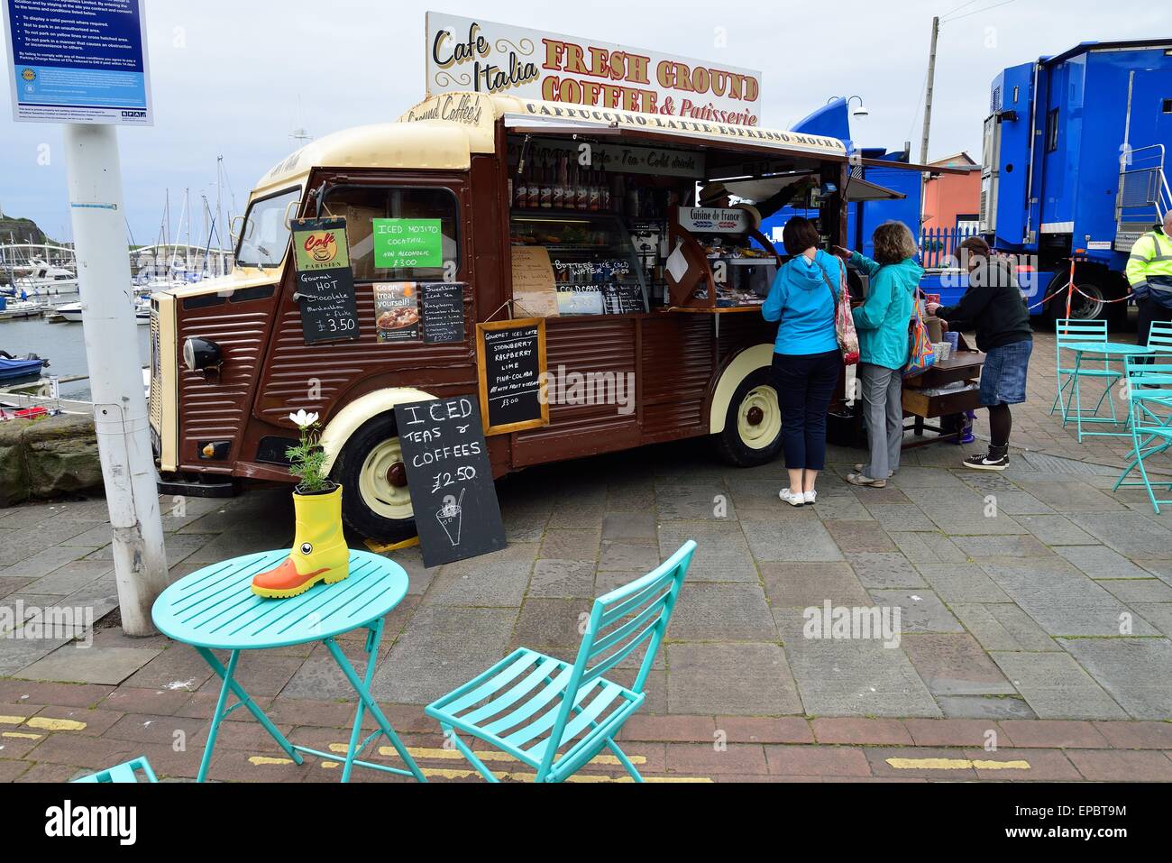 a van selling coffee and other drinks at the whitehaven home and garden festival 2015 with 2 people buying drinks Stock Photo