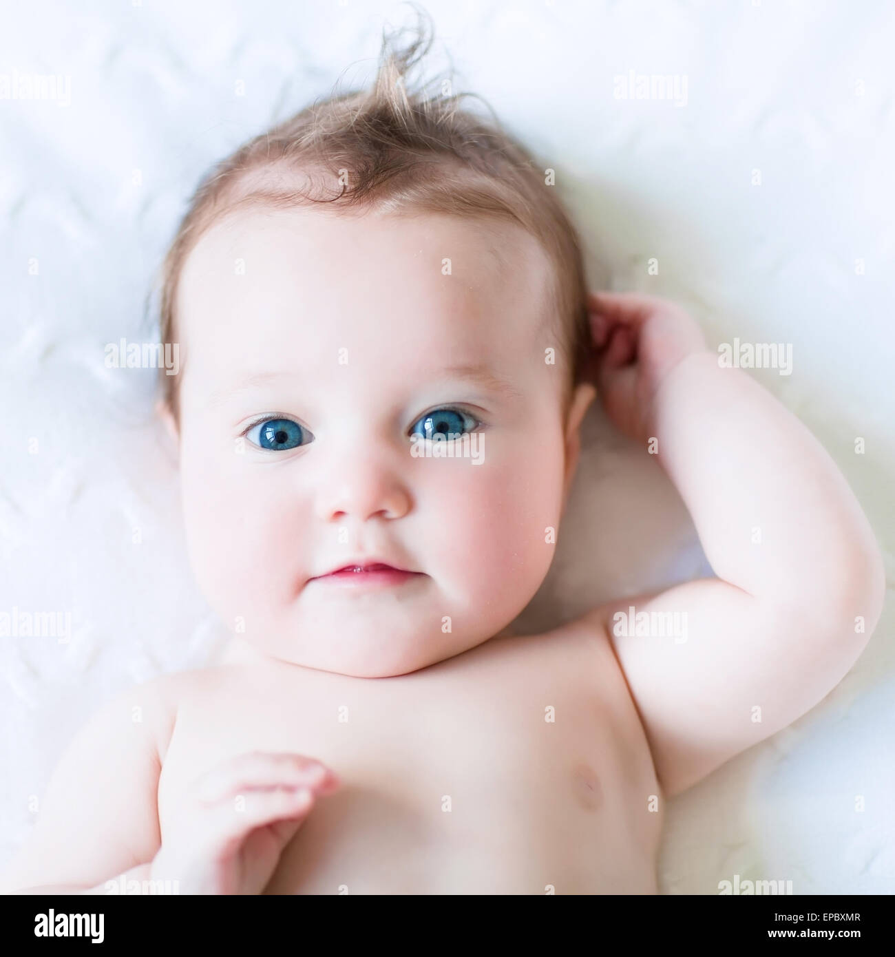 Adorable Blue Eyed Baby On A White Knit Blanket Stock Photo Alamy