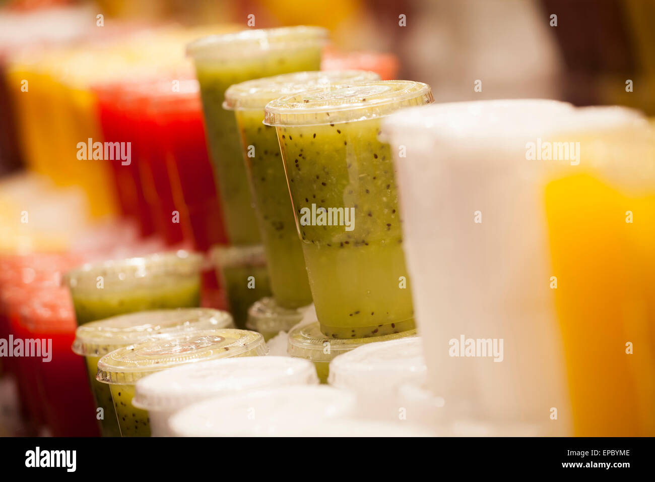 Fresh fruits juices exposed in the market Stock Photo Alamy