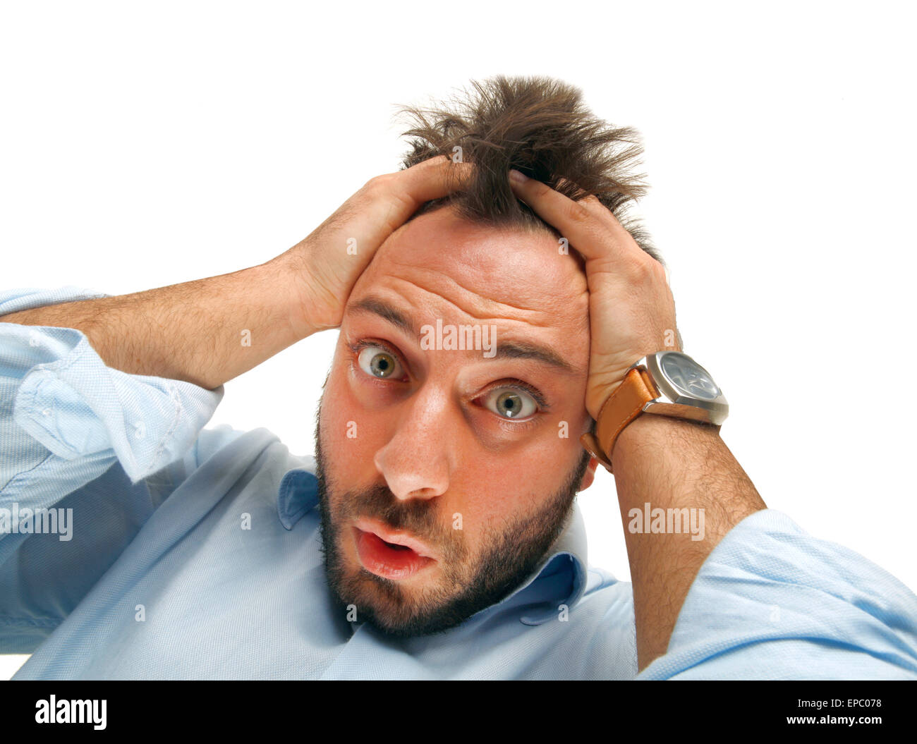 Stressed man tear his hair out, crazy face expression, isolated on white. Stock Photo
