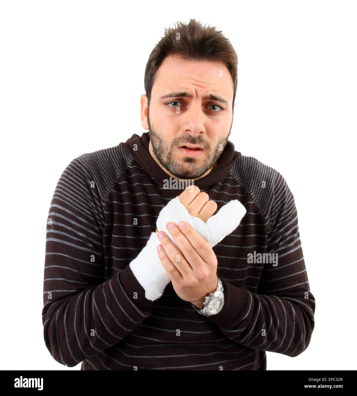 Young man with a fracture of the fifth metacarpal on white background. Stock Photo