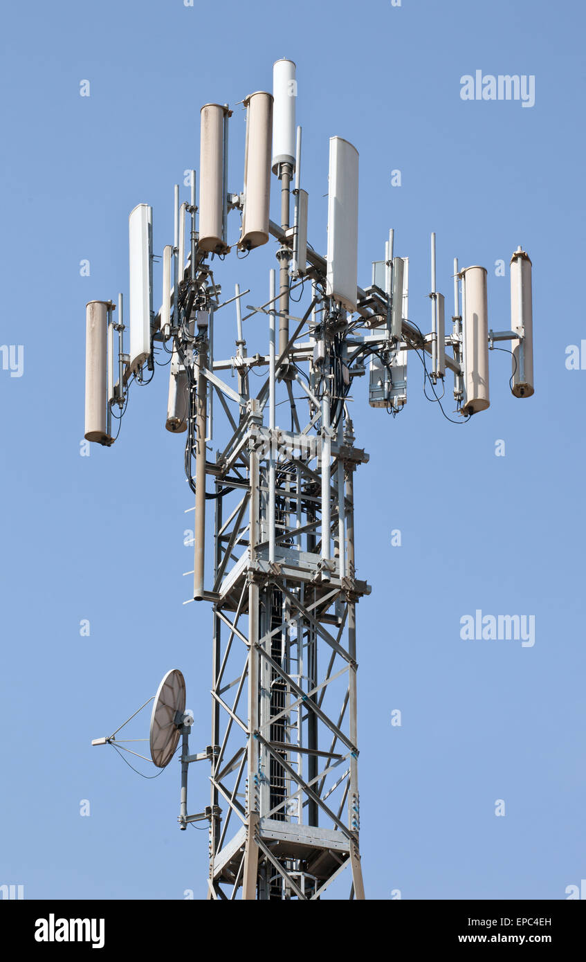 Close up of antenna repeater tower on blue sky Stock Photo Alamy
