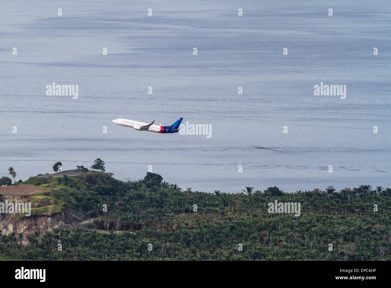 Batavia Air Boeing 737 taking off from Sentani Airport, Papua, Indonesia Stock Photo