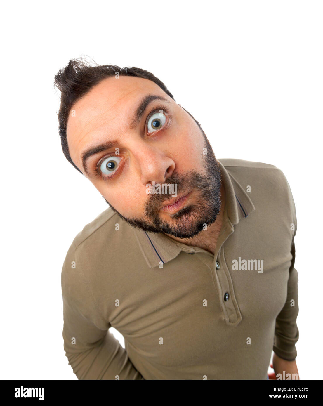 Young man with funny expression on white background. Stock Photo