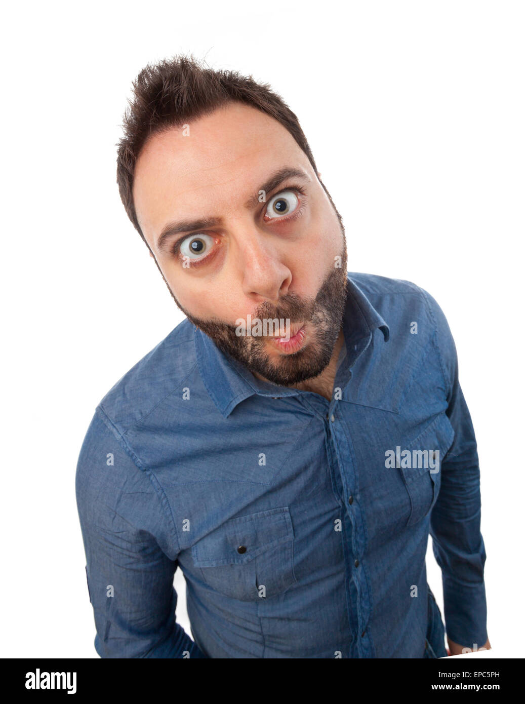 Young man with funny expression on white background. Stock Photo