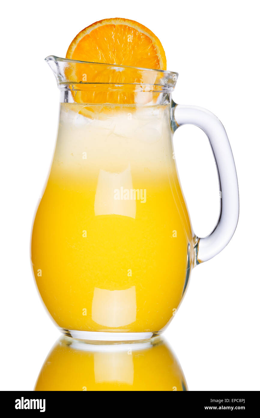 Orange lemonade in pitcher decorated with orange slice. Jug full of