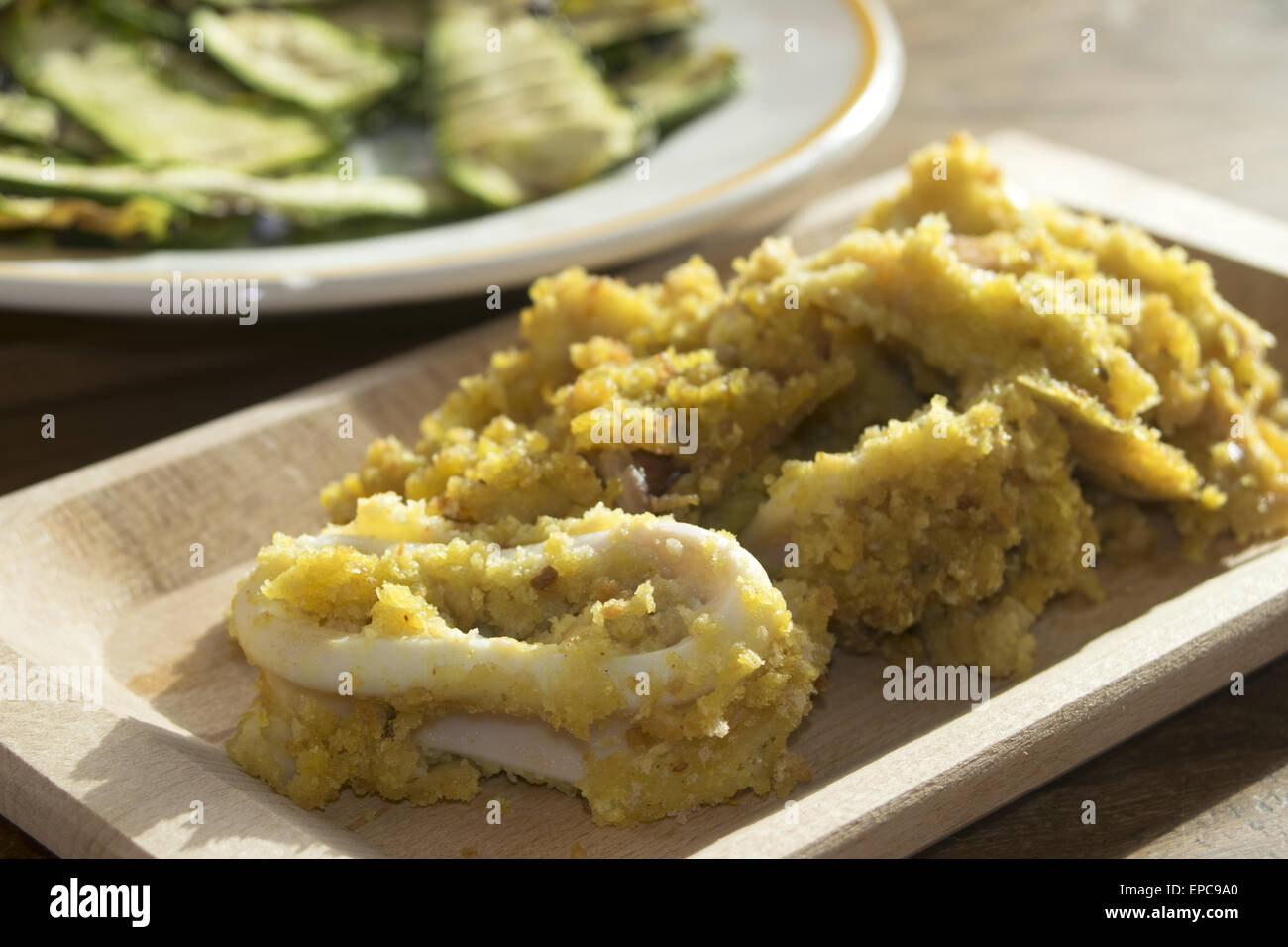 calamari breaded with crumb and aromatic herbs and cooked in the oven