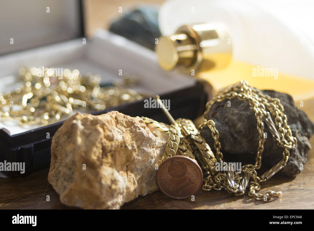 concept of styling charm and wealth with jewels and perfumes Stock Photo