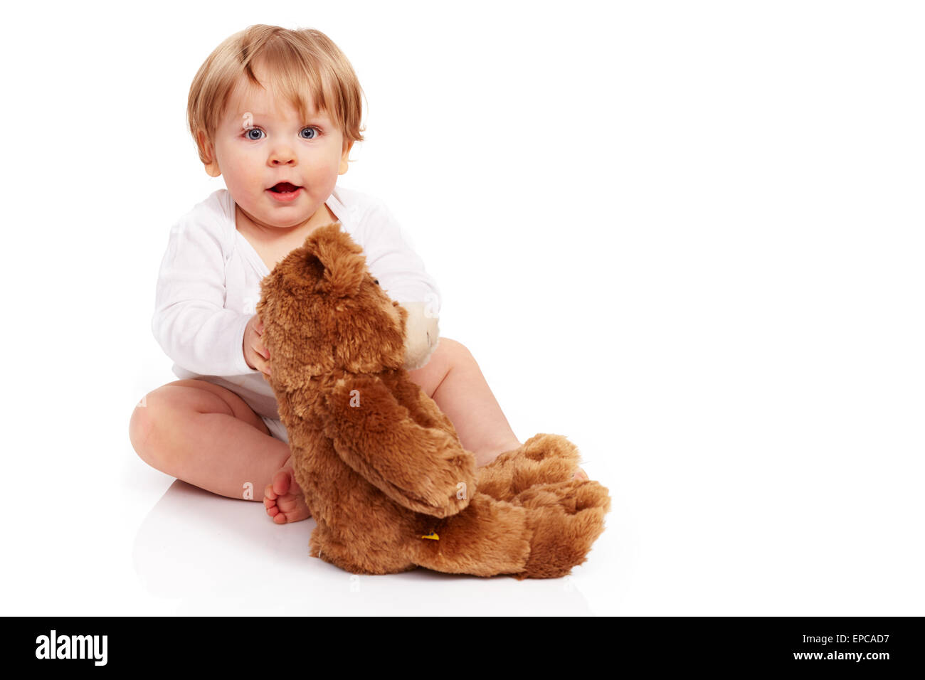 Little boy cuddling with his teddy bear Stock Photo - Alamy