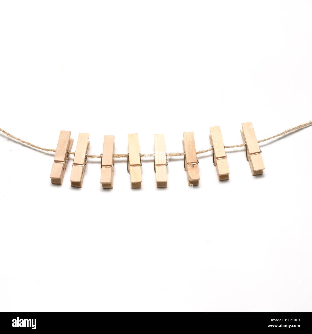 cloth pin hang with rope on a white background Stock Photo - Alamy