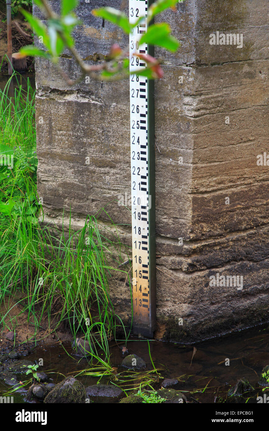 Water gauge fix to concrete wall showing extremely low water level Stock Photo
