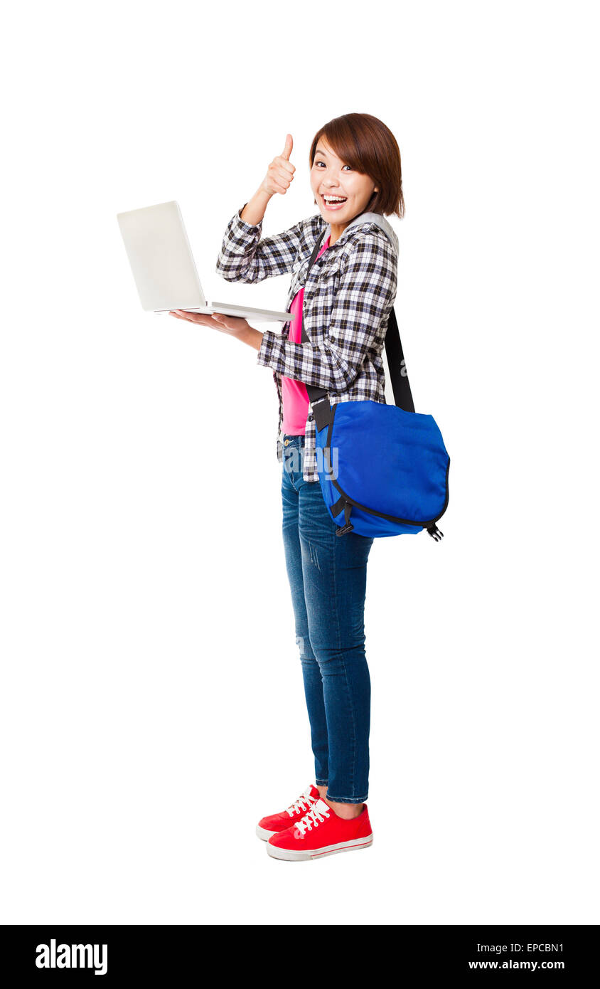 Young happy  student with laptop and thumb up Stock Photo