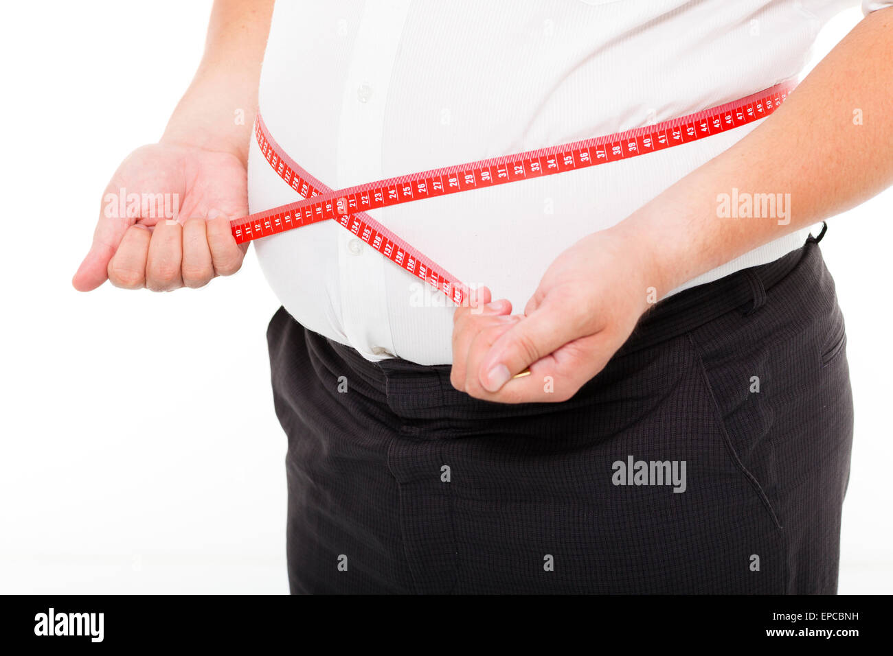 Fat man holding a measurement tape Stock Photo