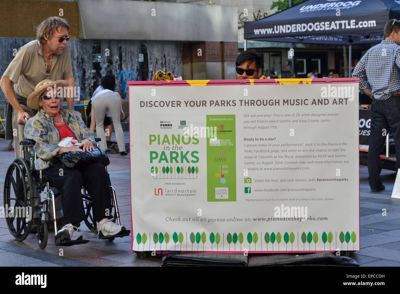 elderly mother and son enjoying Pianos in the Parks, Westlake Park, Seattle, Washington, USA Stock Photo