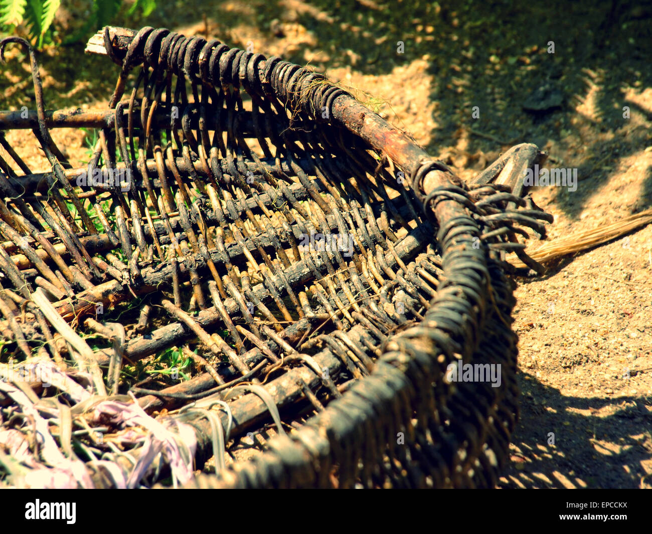 Old broken wicker basket on soil taken closeup Stock Photo Alamy