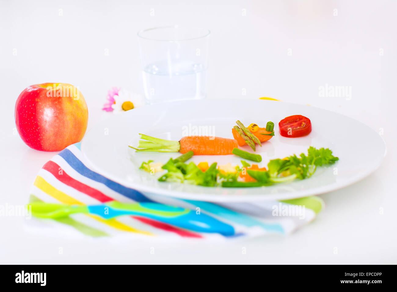 Healthy vegetarian lunch for little kids, vegetables and fruit served as animals, corn, broccoli, carrots and fresh strawberry Stock Photo