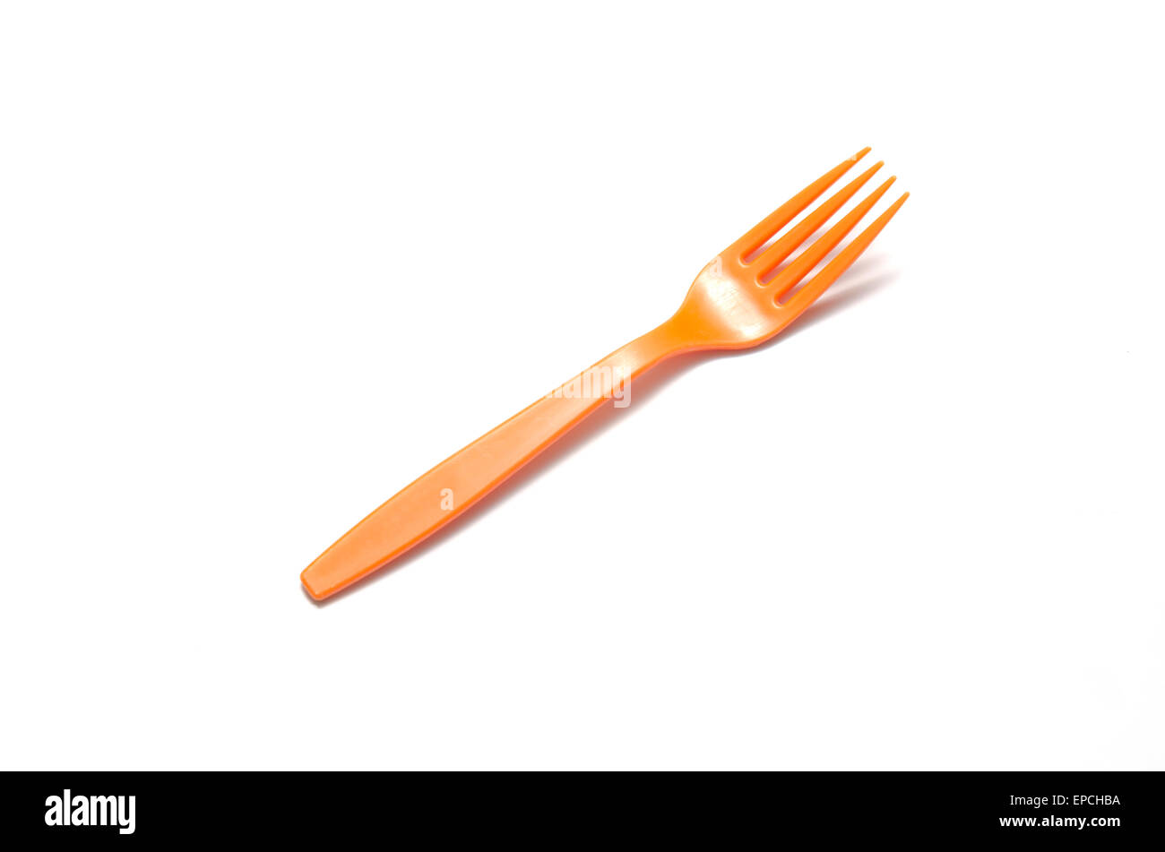 orange plastic fork on a white background Stock Photo Alamy