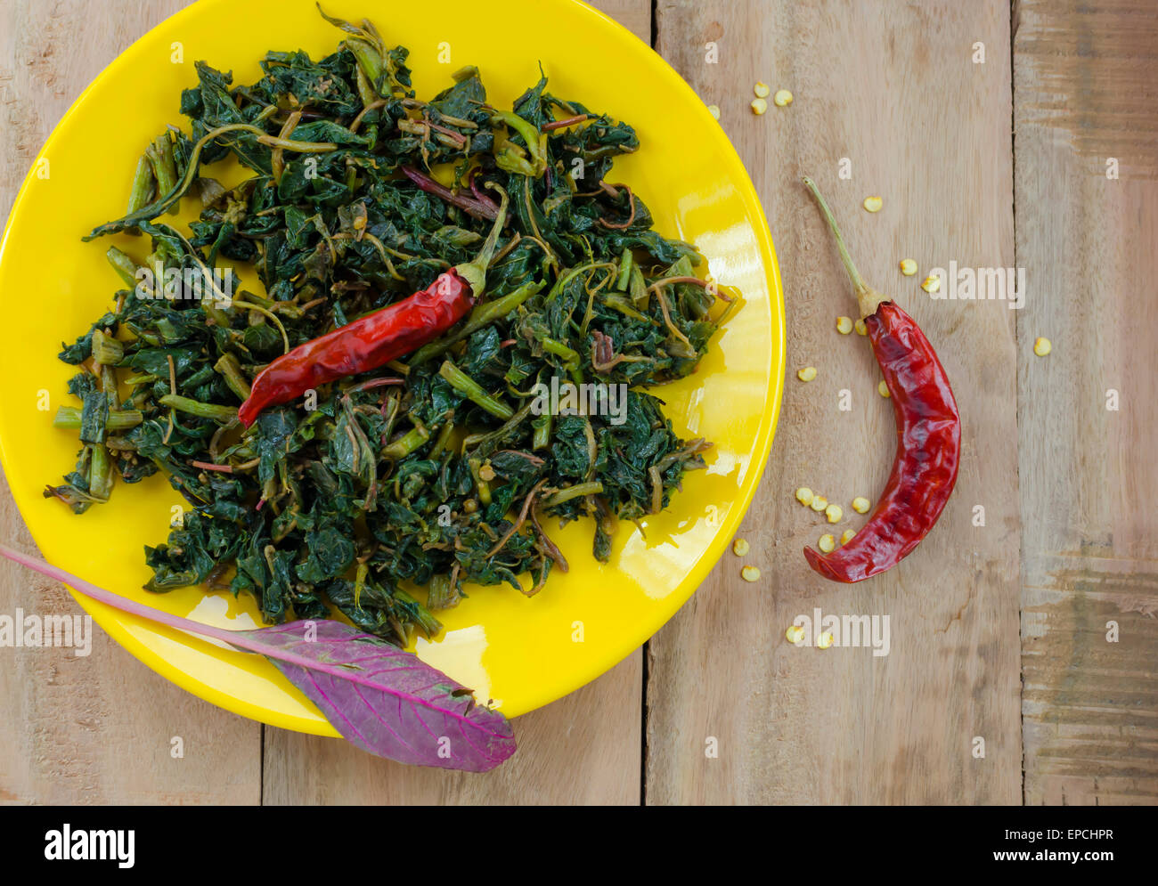 red spinach stir fried with chillies Stock Photo