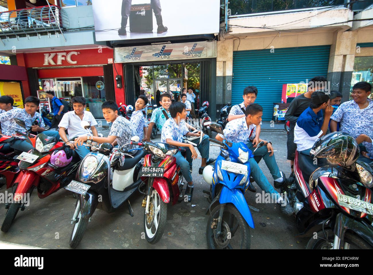 delivery boys on motorcycles at kfc in manado sulawesi indonesia Stock Photo