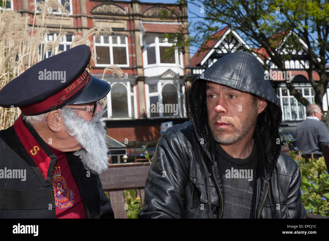 Southport, Merseyside UK, 16th May, 2015. Homeless man Anthony Smith being assisted by Mr Groom.  The Salvation Army Southport corps invited Salvationists and others in fundraising, with a series of events in the town centre including massed choirs and march. Credit:  Mar Photographics/Alamy Live News Stock Photo