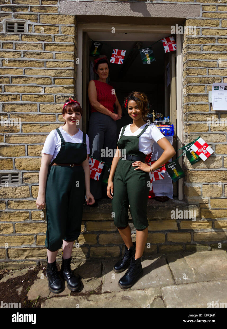 Haworth, West Yorkshire, UK. 16th May, 2015. Three women in costume operating a pop up cafe at Haworth 1940s weekend, an annual event in which people dress in period costume and visit the village of Haworth to relive the 1940s. After complaints in previous years, the organisers have requested that people don't wear German Uniforms. Credit:  West Yorkshire Images/Alamy Live News Stock Photo