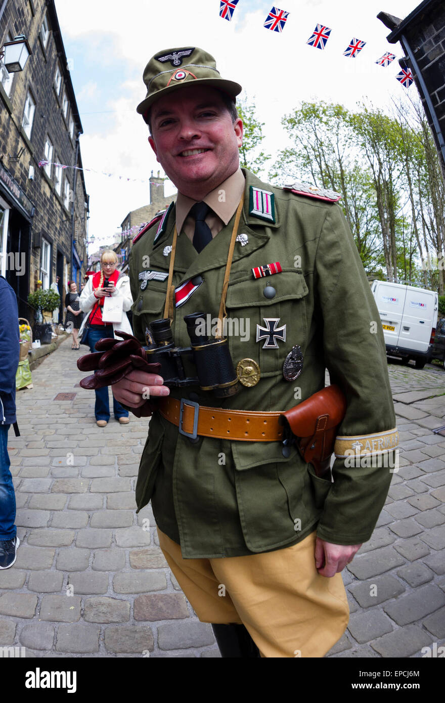 Haworth, West Yorkshire, UK. 16th May, 2015. A man dressed in German Army uniforms at Haworth 1940s weekend, an annual event in which people dress in period costume and visit the village of Haworth to relive the 1940s. After complaints in previous years, the organisers have requested that people don't wear German Uniforms. Credit:  West Yorkshire Images/Alamy Live News Stock Photo