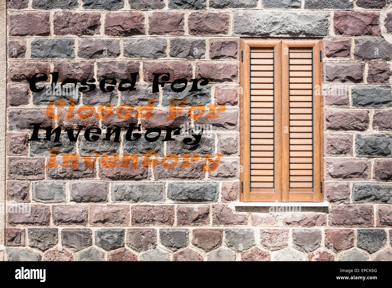 Window on the wall of basalt with written 'Closed For Inventory' Stock Photo