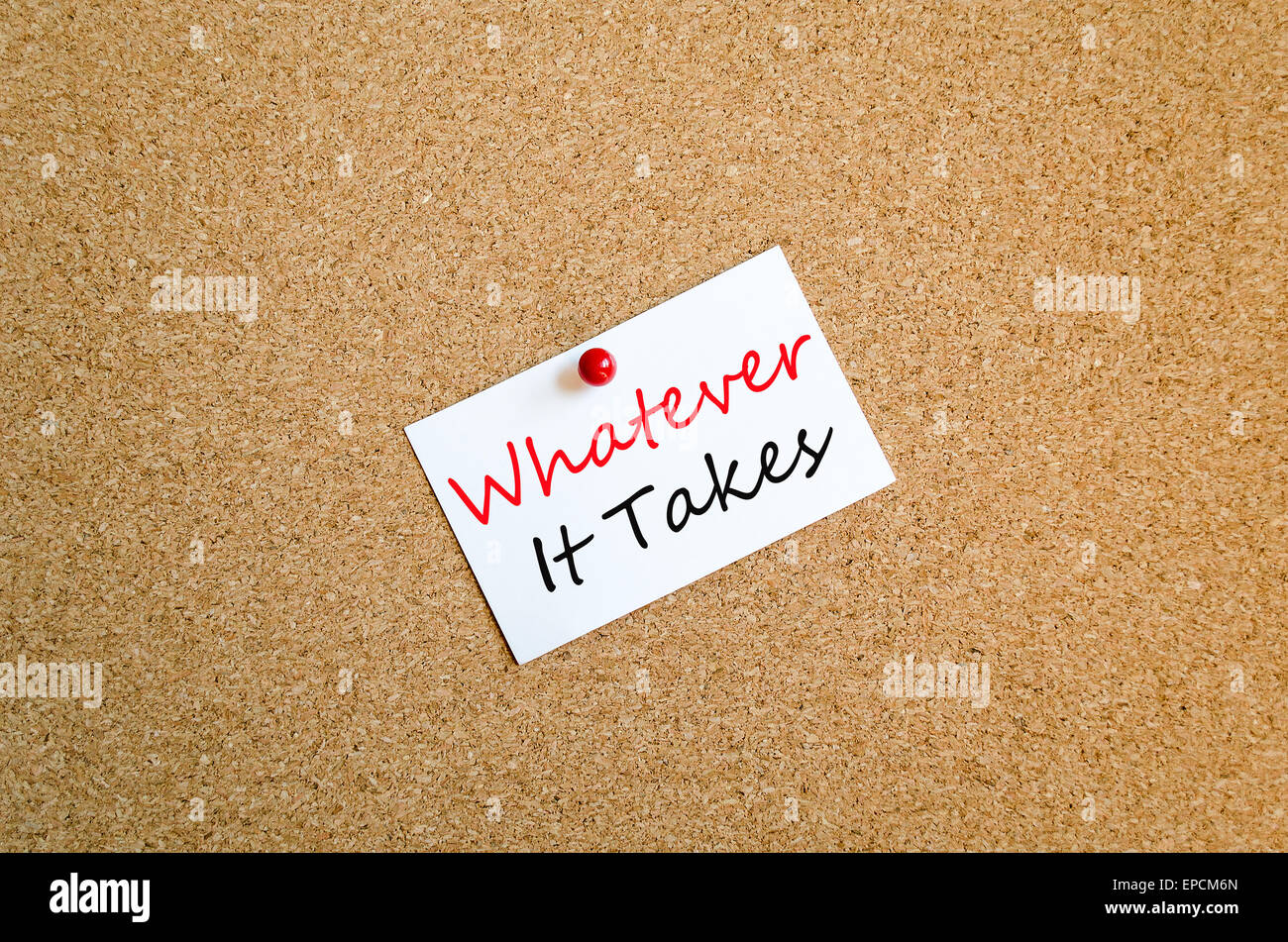 Sticky Note On Cork Board Background Whatever it takes concept Stock Photo