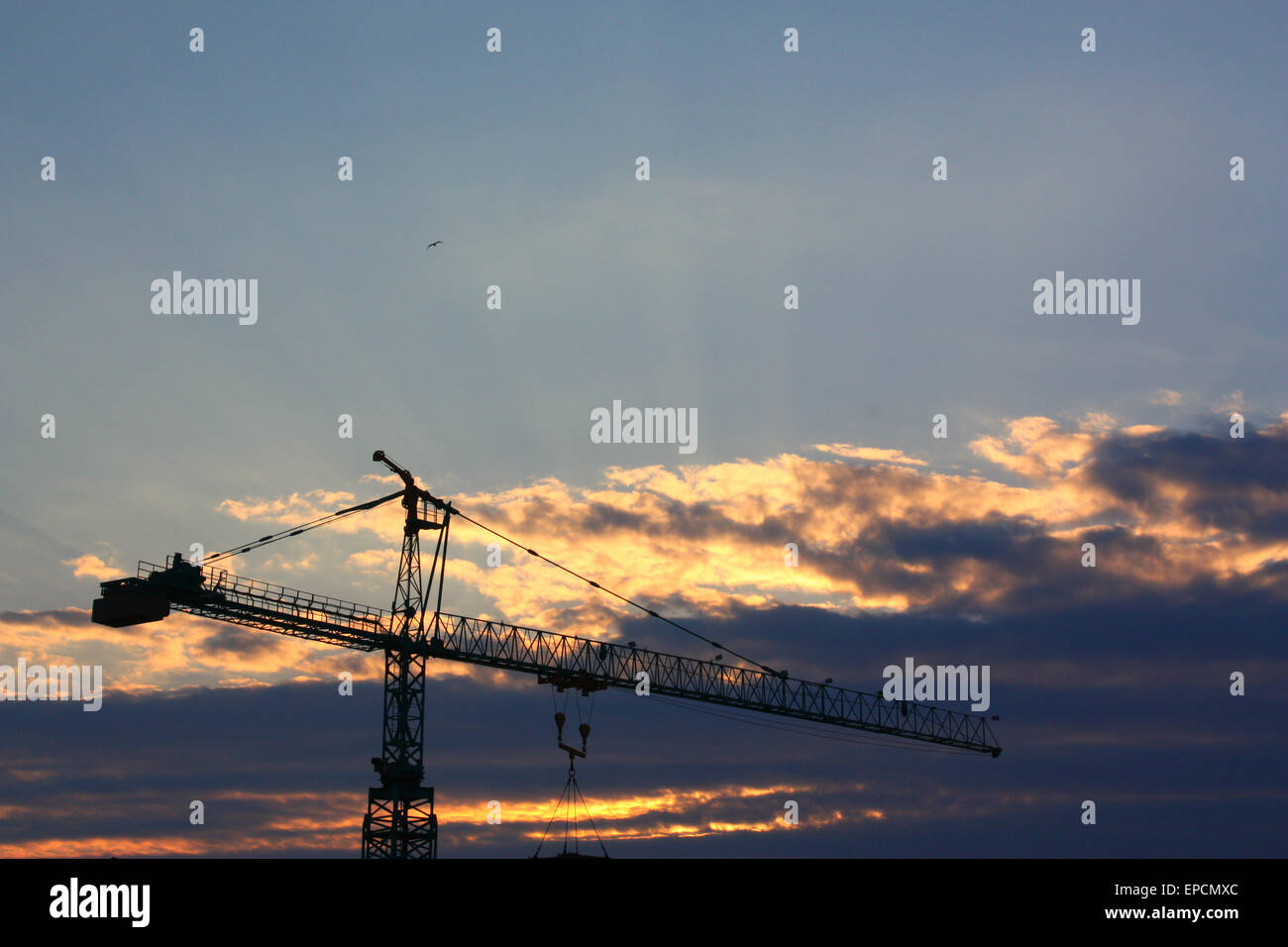 Construction crane silhouette with cloudy sky Stock Photo - Alamy