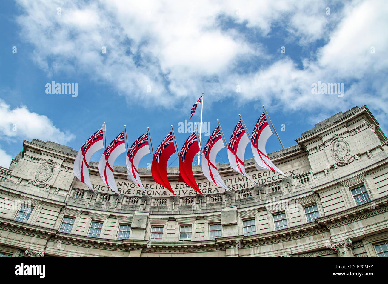 Admiralty Arch is a landmark building in London, UK which incorporates an archway providing access to The Mall. Ensign Flags. British. Space for copy Stock Photo
