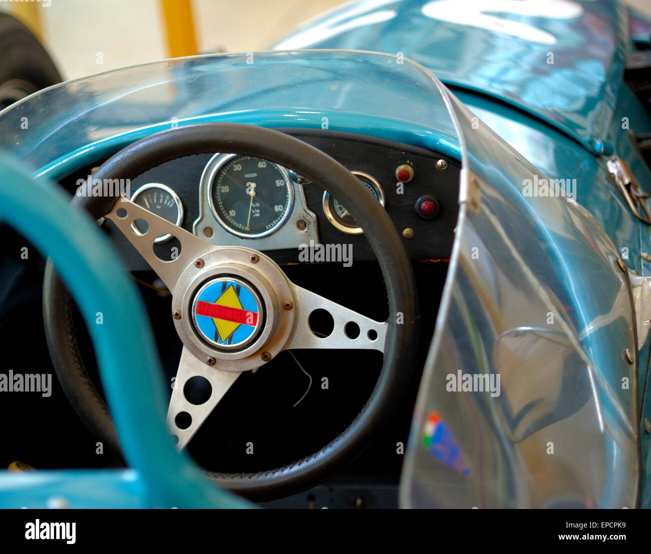 old sports car dashboard colored in silver and ciano. Stock Photo
