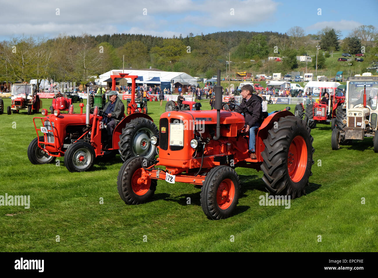 Royal Welsh Spring Festival Builth Wells, Powys, Wales, UK May 2015. Vintage tractors and vehicles display parade. Over 80 vehicles took part in the procession around the display arena including this 1967 Nuffield 10/85 tractor as afternoon sunshine shone on the rural festival showground at Builth Wells in mid Wales. Stock Photo