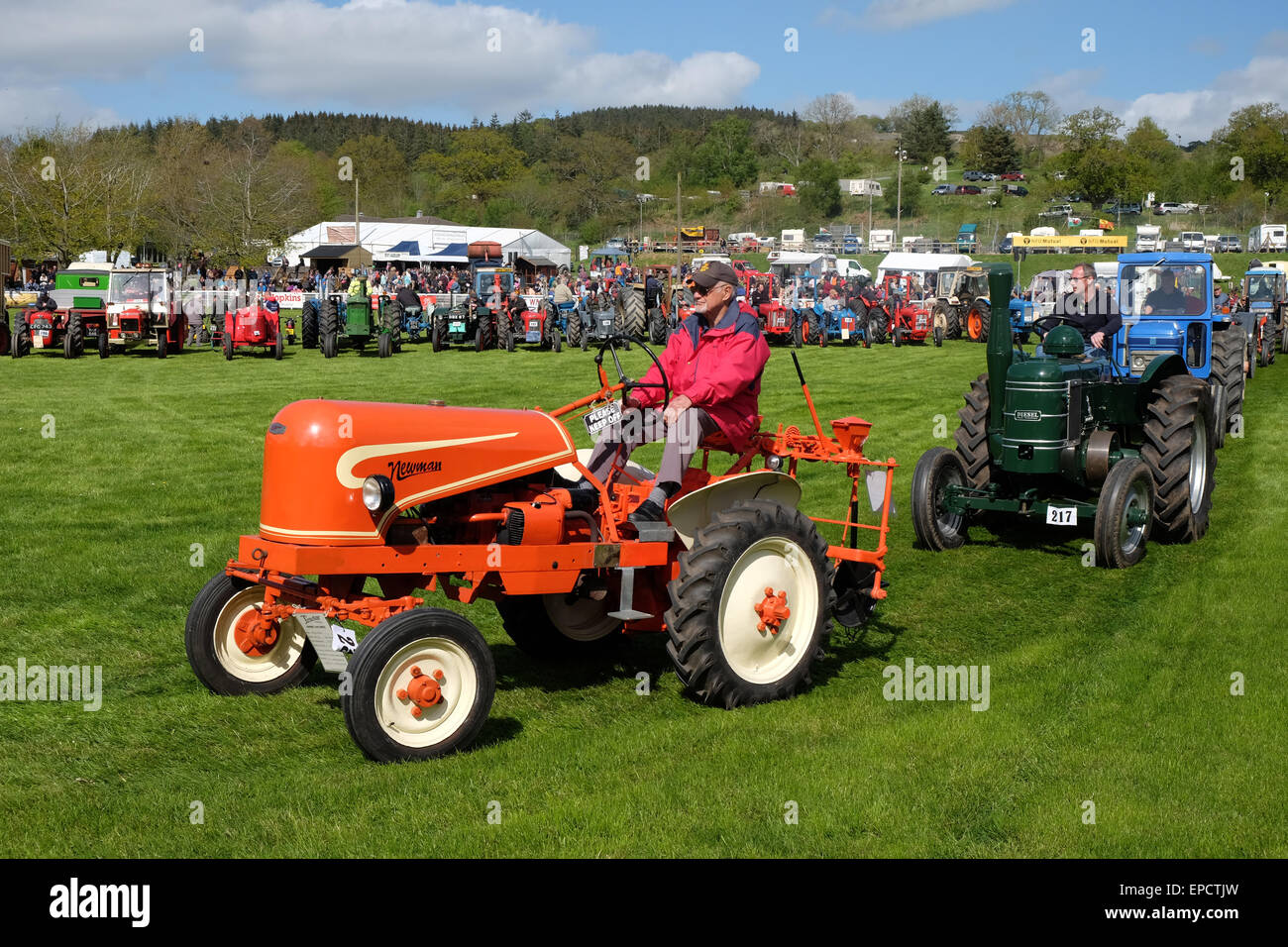 Royal Welsh Spring Festival Builth Wells, Powys, Wales, UK May, 2015. Parade of vintage tractors. Over 80 vehicles took part in the procession around the display arena including this late vintage 1940s Newman tractor built at Grantham, Lincolnshire as afternoon sunshine shone on the rural festival showground at Builth Wells in mid Wales. Stock Photo